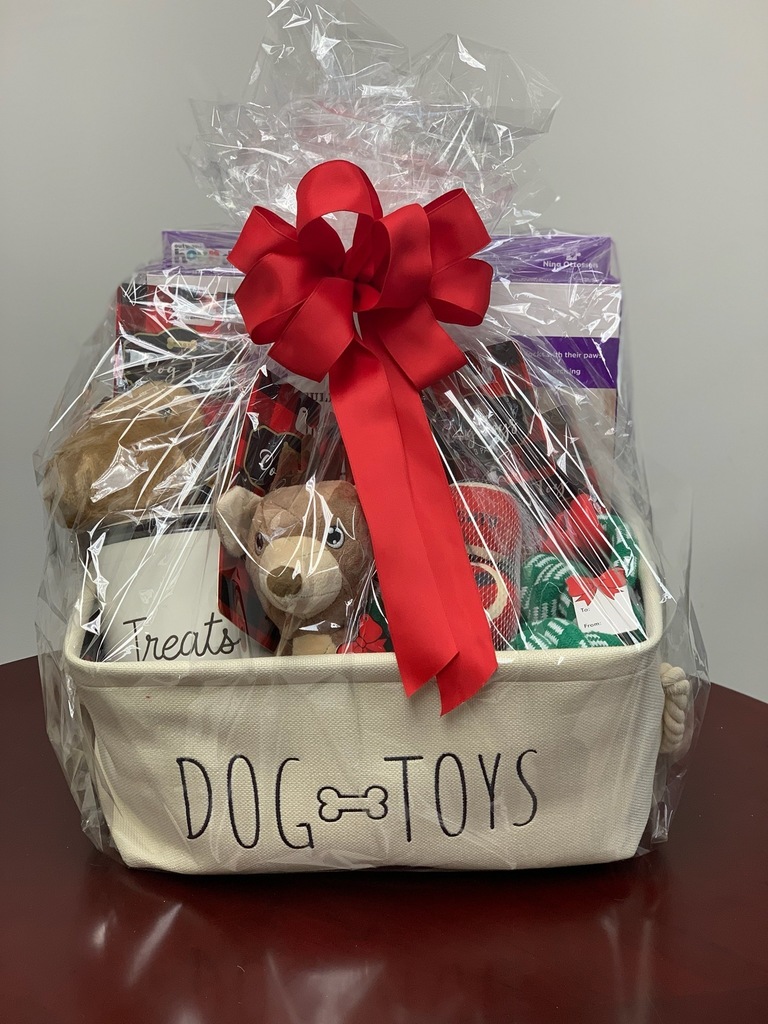A gift basket filled with dog-related items.