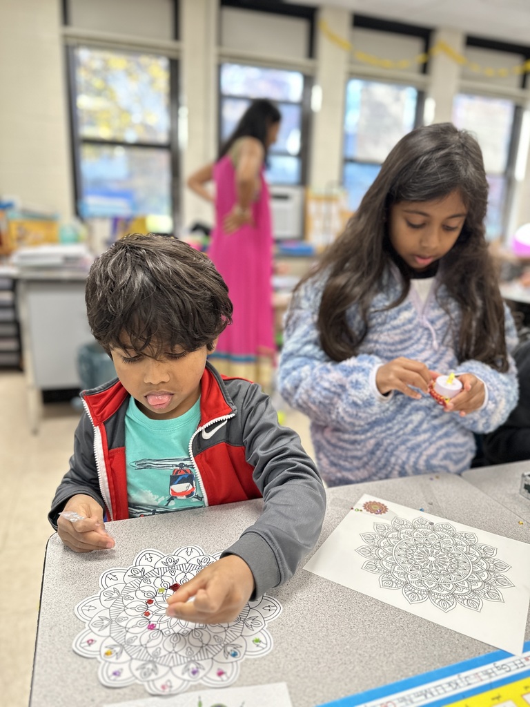 two students designing their rangali