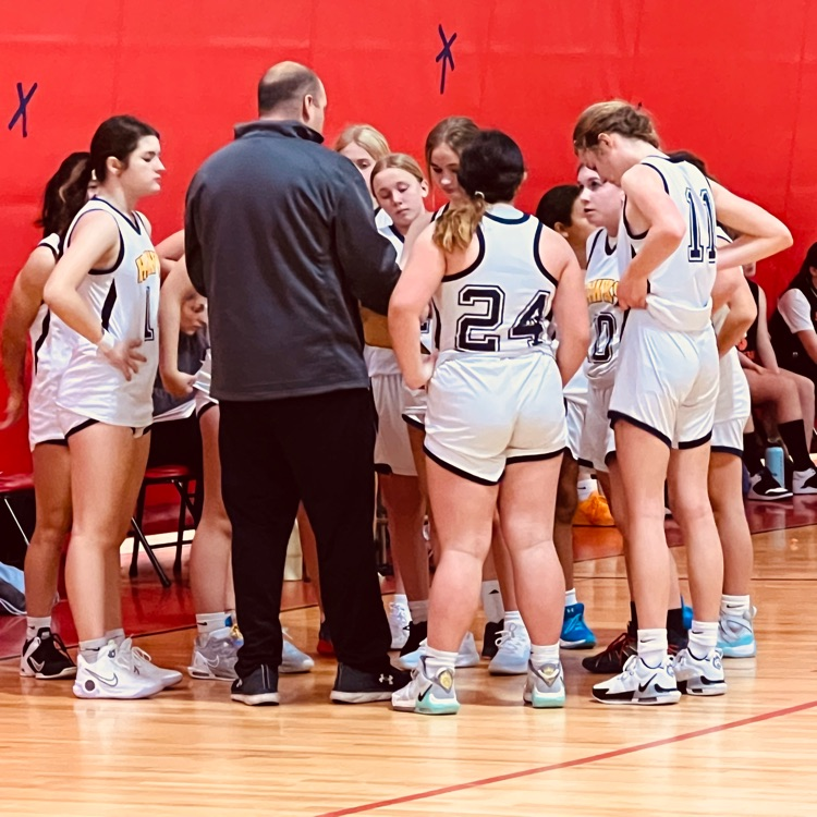 Girls bball team at a time out