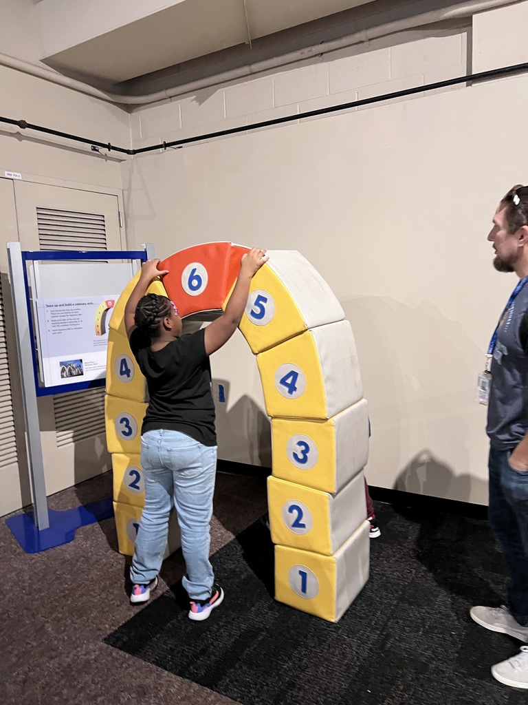 Students learn how to build an arch.