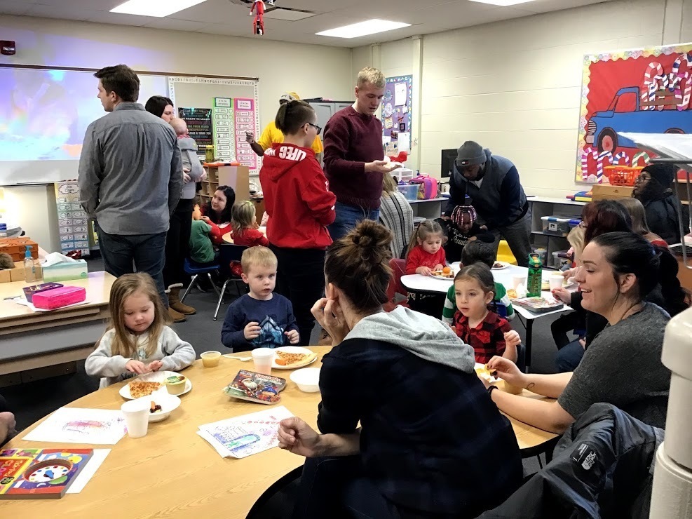 parents and kids having their morning breakfast/ snack