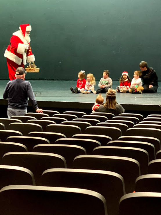 The kids wait patiently for Santa to arrive