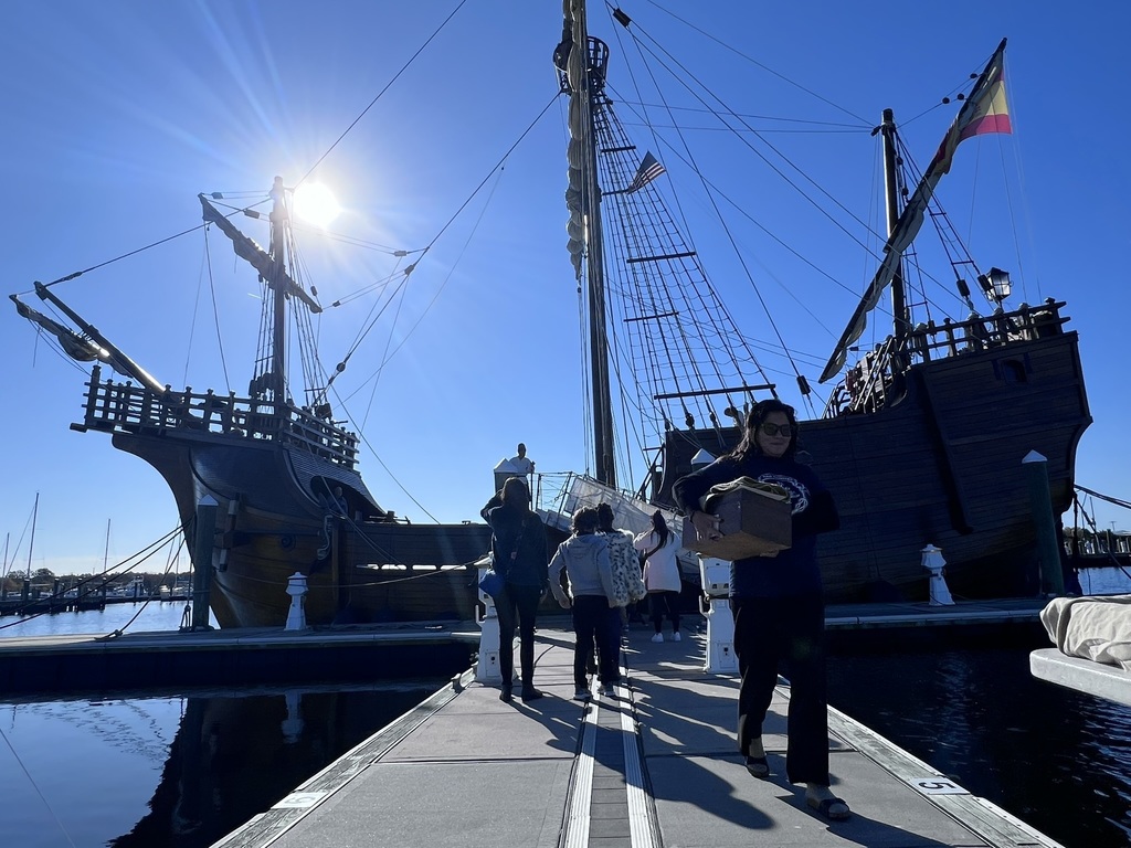 students walking up to board the Nao trinidad ship