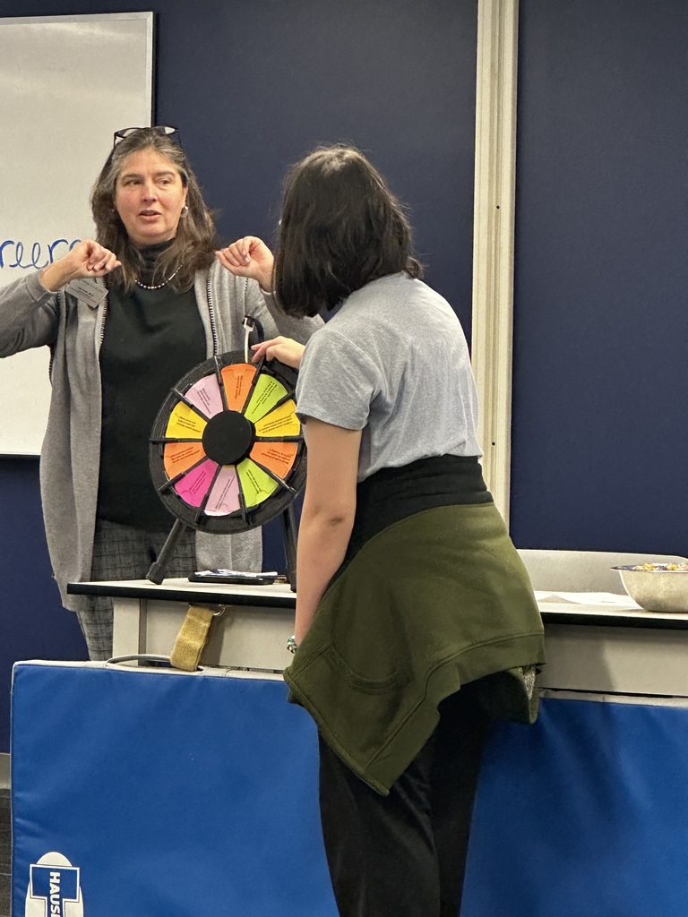 Student spinning a pinwheel.