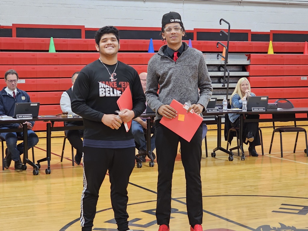 two CHS football players being recognized at the 11.20.23 board meeting