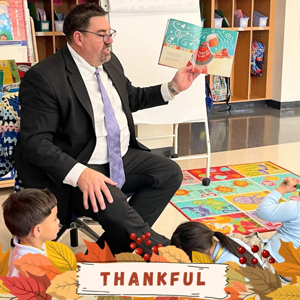 principal reading book to class