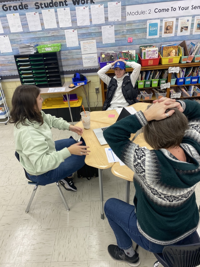 Three teachers working on a lesson plan