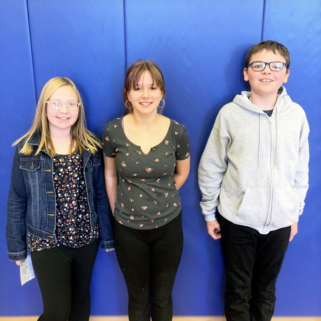 three students pose for a picture