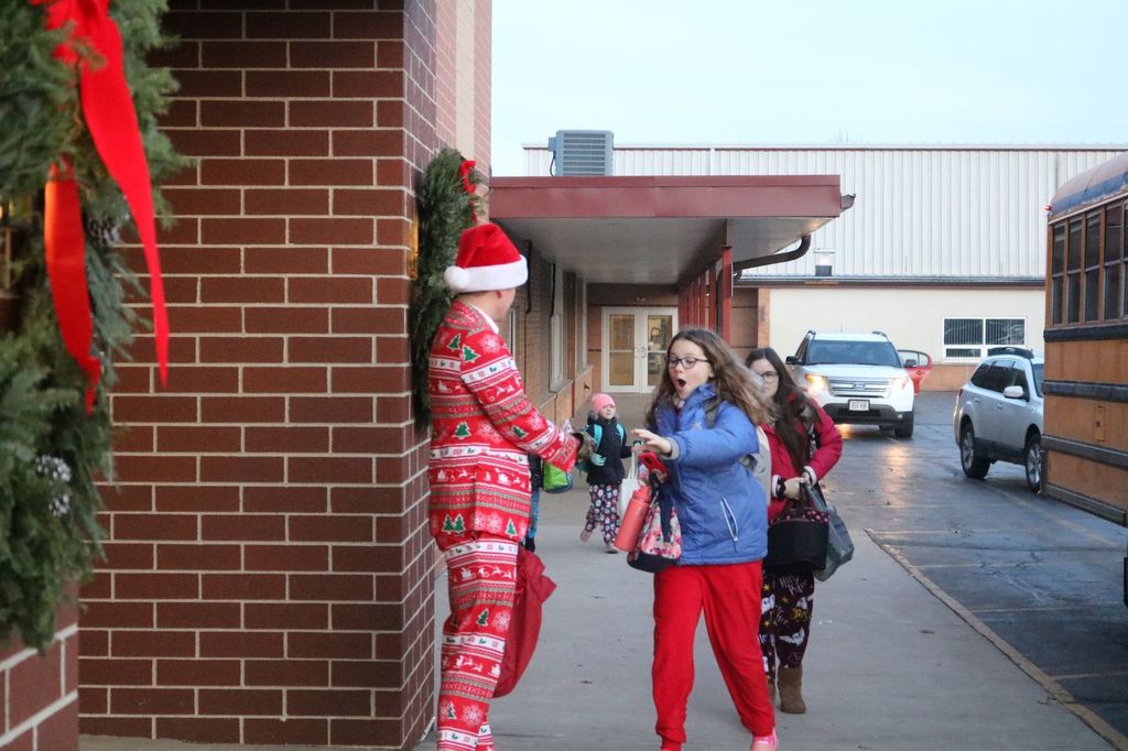 Jason Oyen hands out candy canes to Potosi students