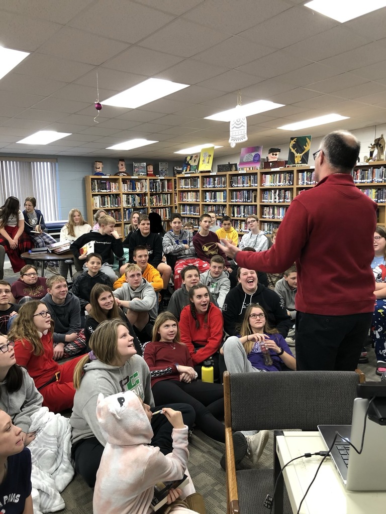 Brad having a light conversation with the seventh and eighth graders.