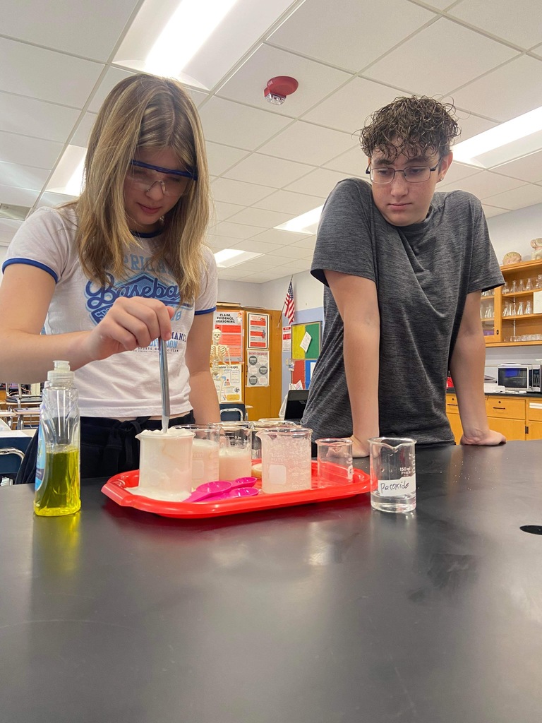 Students with googles and lab materials