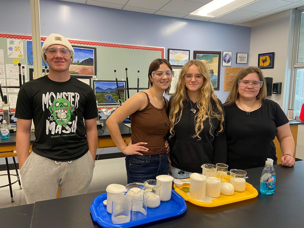 Students with googles and lab materials