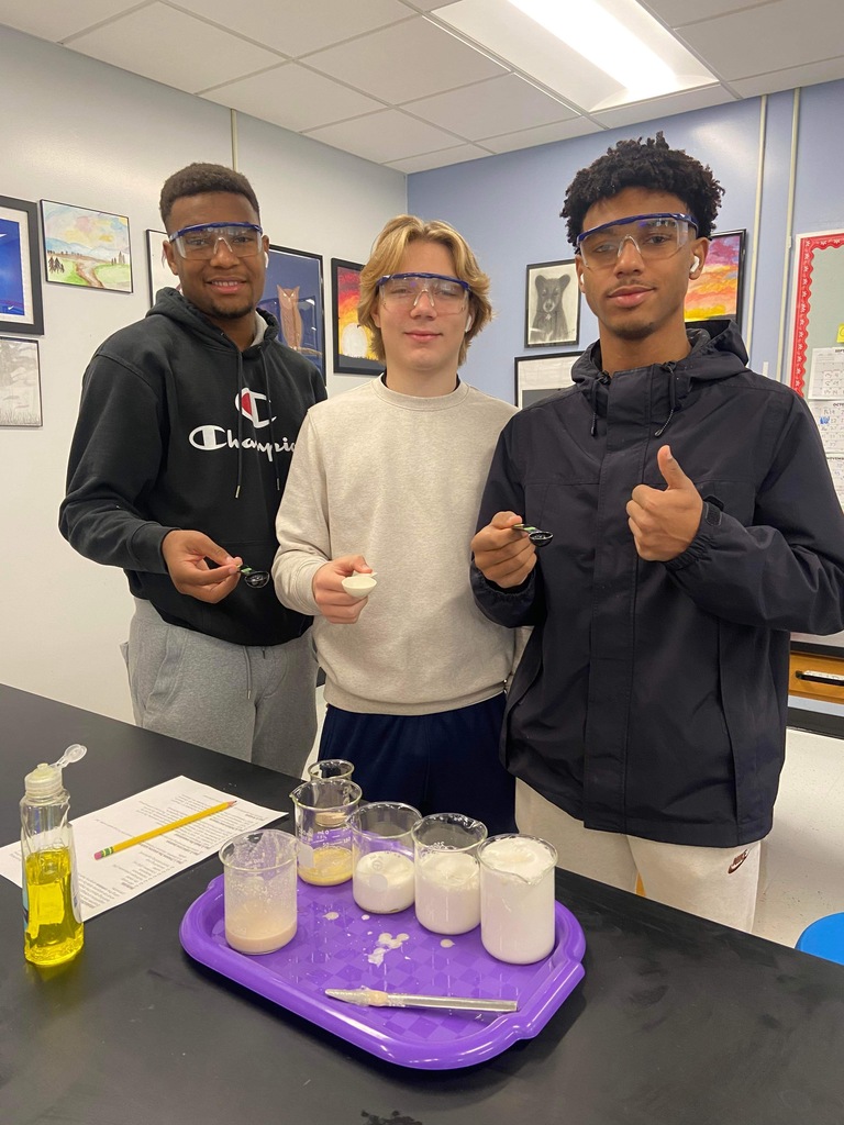 Students with googles and lab materials