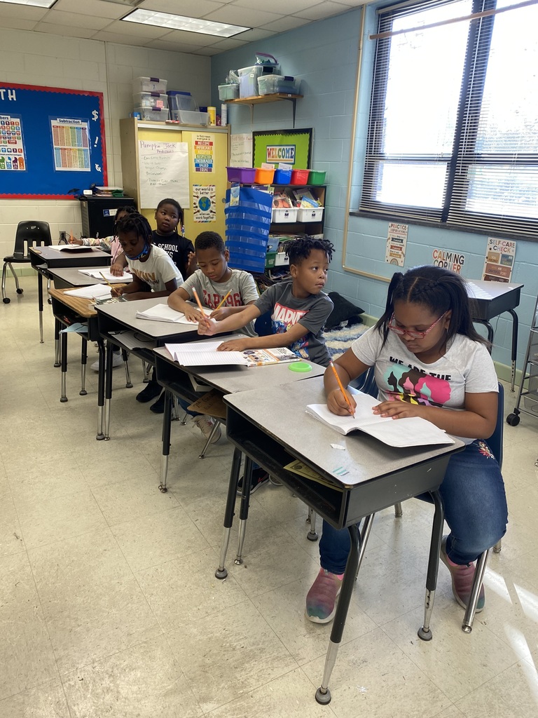 Students draw along with Peter Brown.
