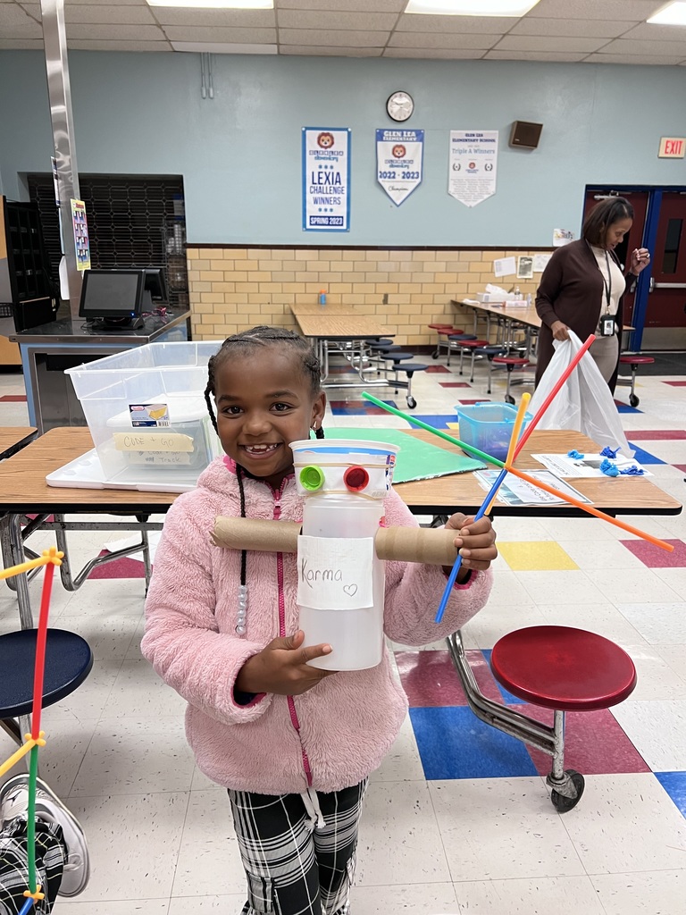 A 2nd grade student shows off their robot.