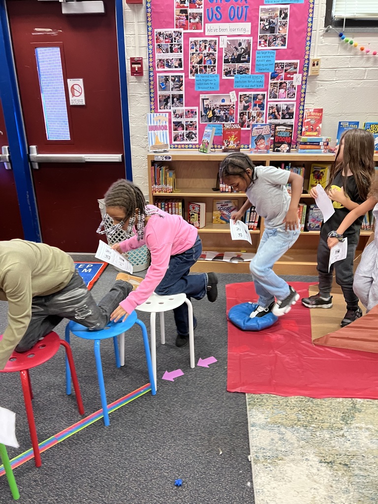 Students crawl across the bridge to reach the end.