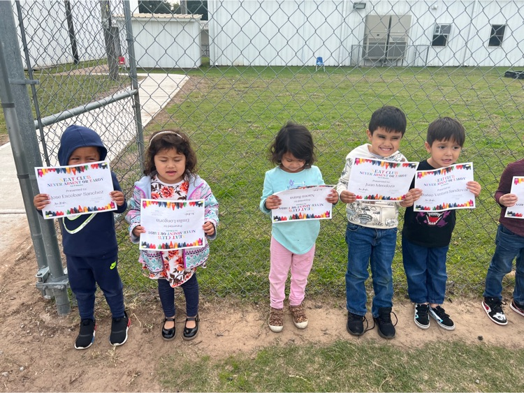 students holding award