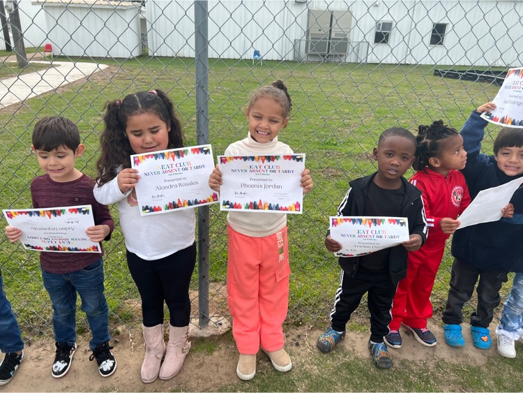 students holding award