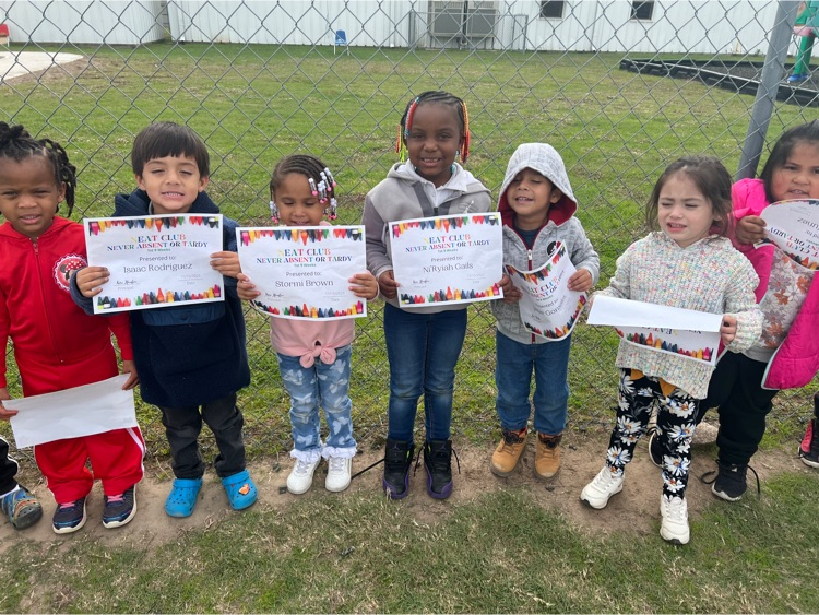 students holding award