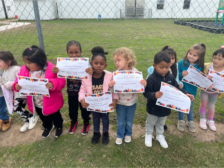 students holding award