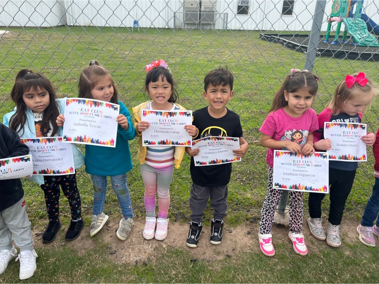 students holding award