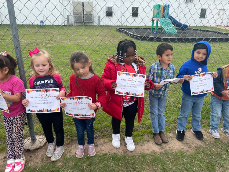 students holding award