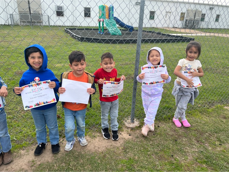 students holding award