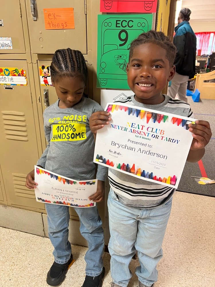 students holding award