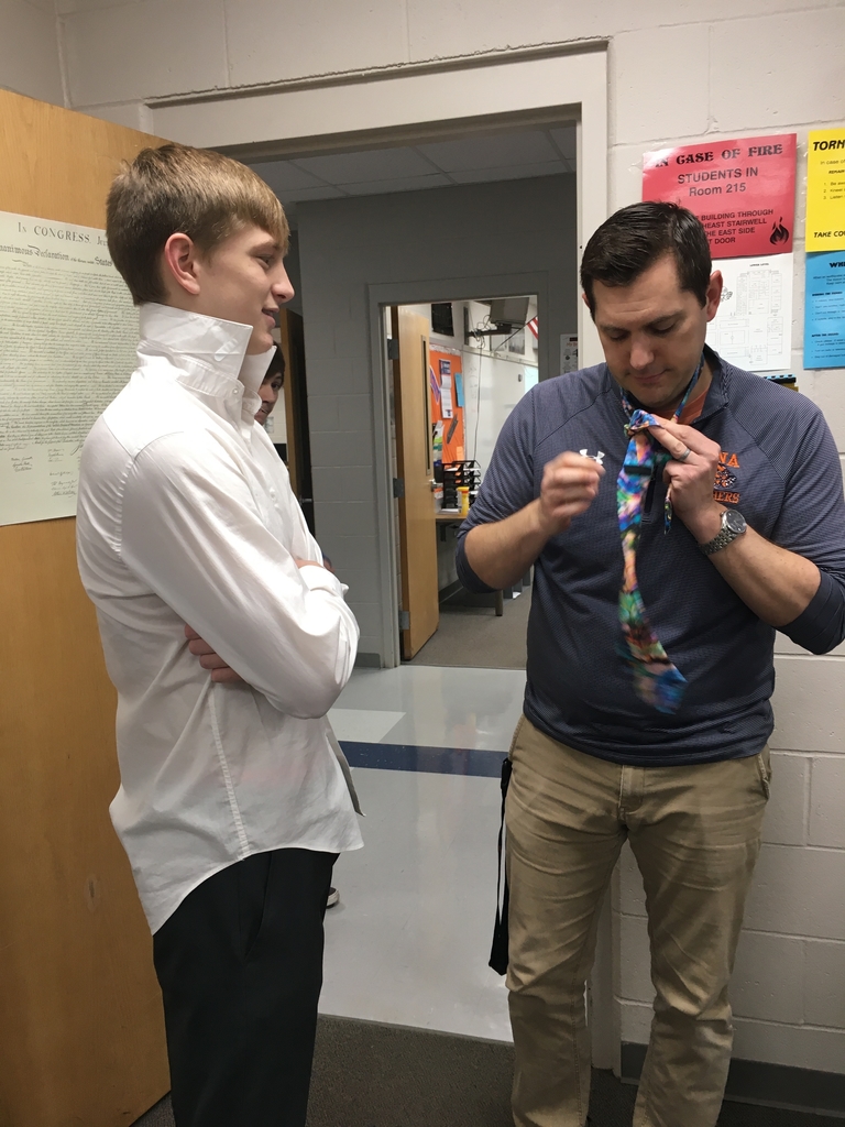 Shalter showing how to tie and tie 