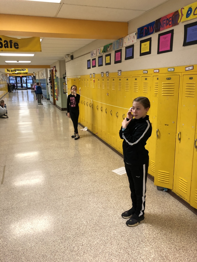 4th graders using cup phones