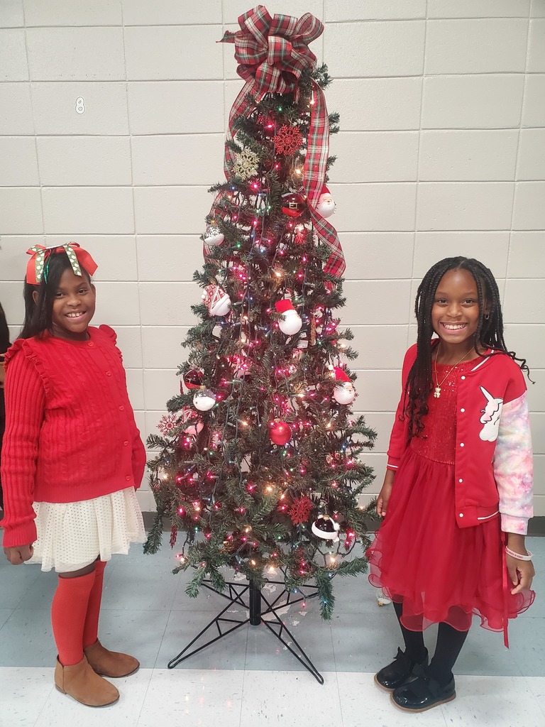 two girls around the tree