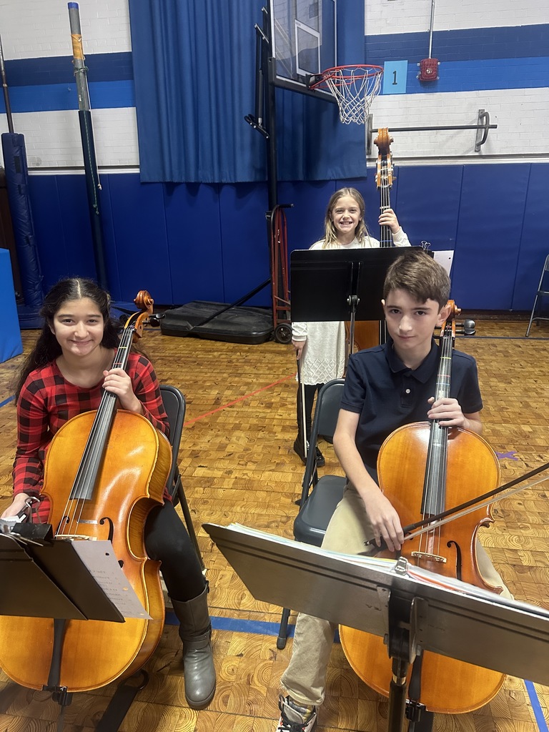 three orchestra students with their instruments