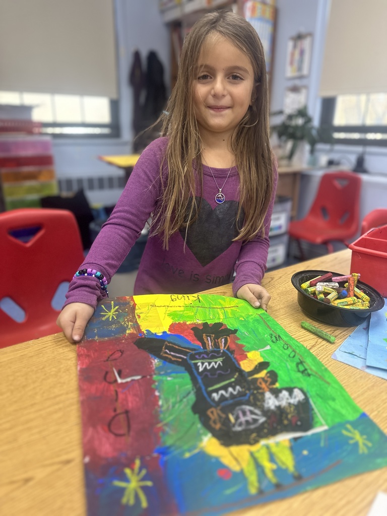 first grade student working on their painting
