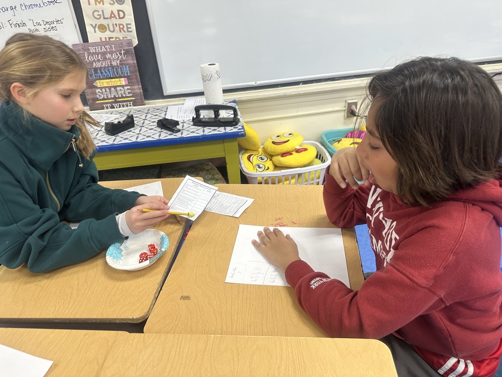 two fourth grade students playing decimal yahtzee