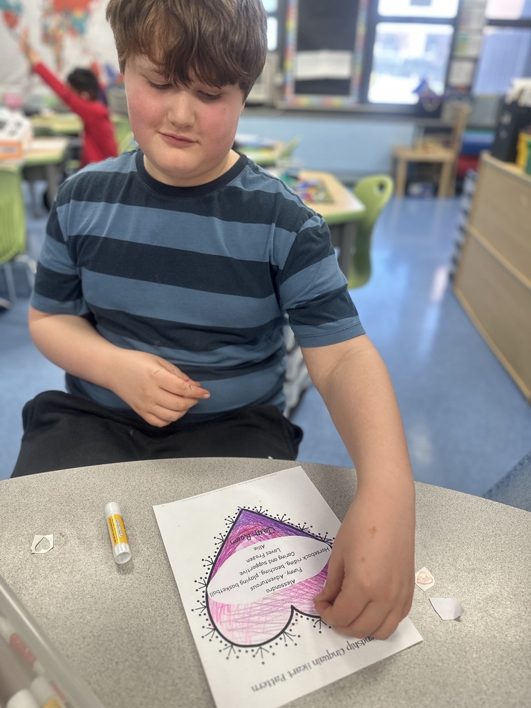 student making a heart craft on Valentine's Day