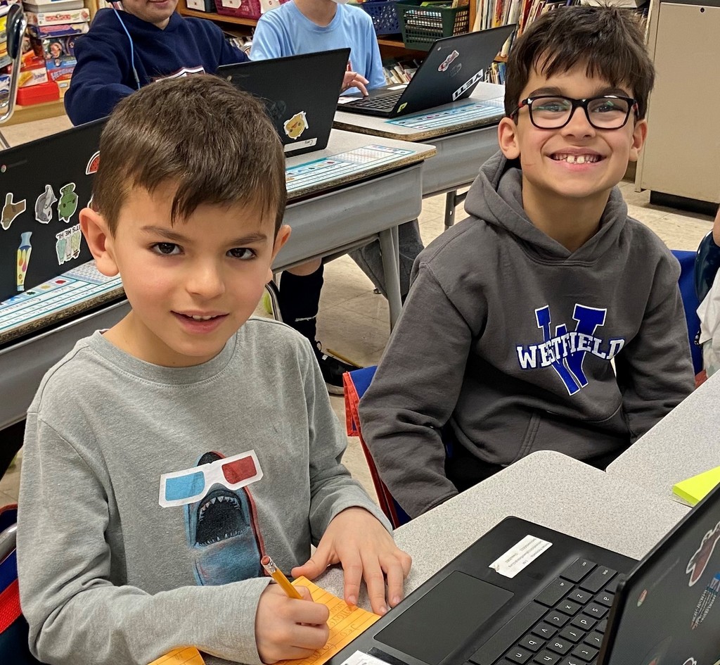 second grade students working