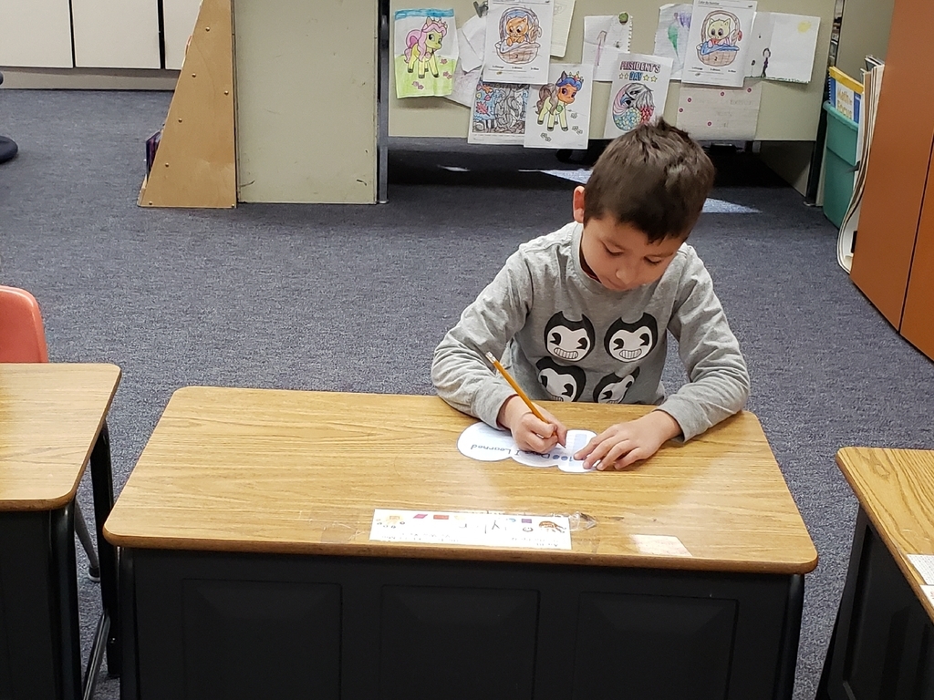 Tyler wrote what he had accomplished after 100 days of kindergarten.