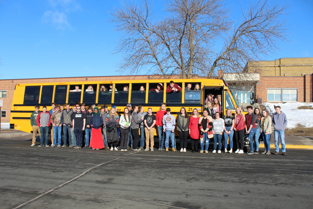 senior class in front of bus