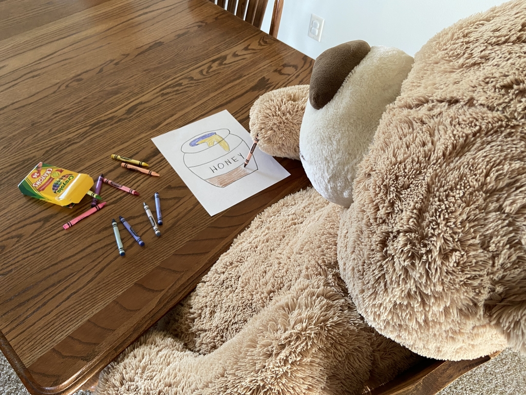 Teddy Bear coloring a picture.