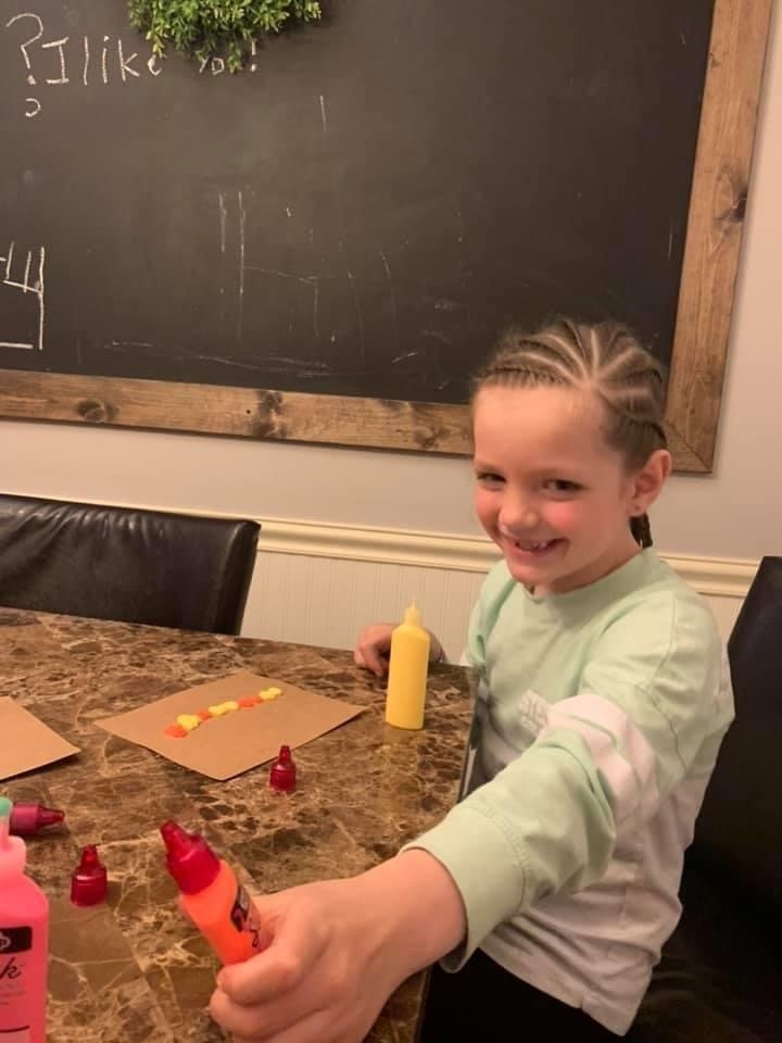 Auria creating patterns with paint