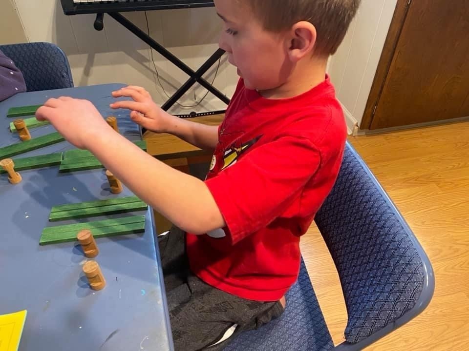 Jason creating patters with blocks