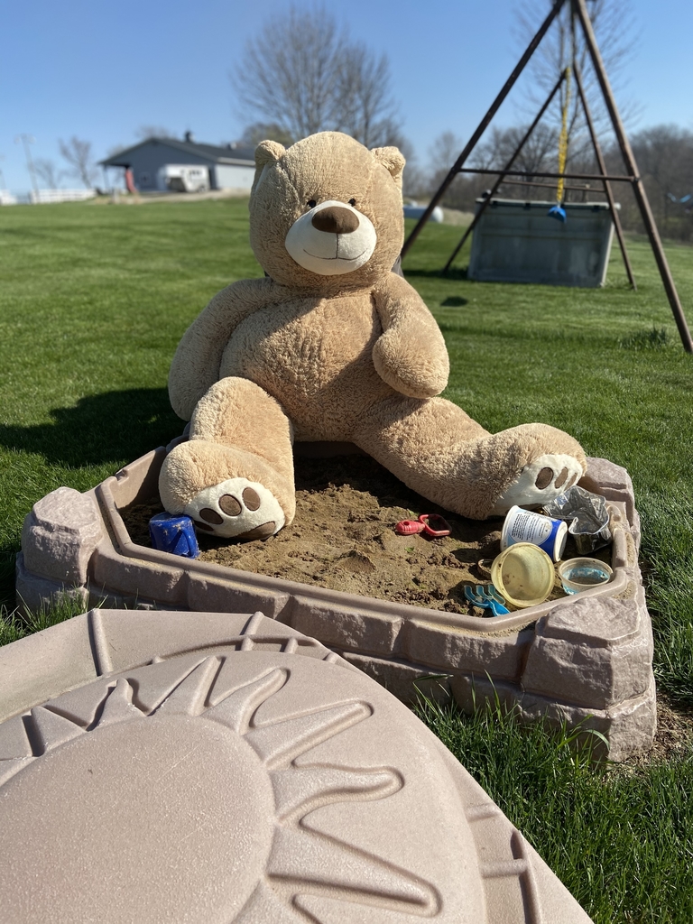 Teddy Bear in a sandbox.