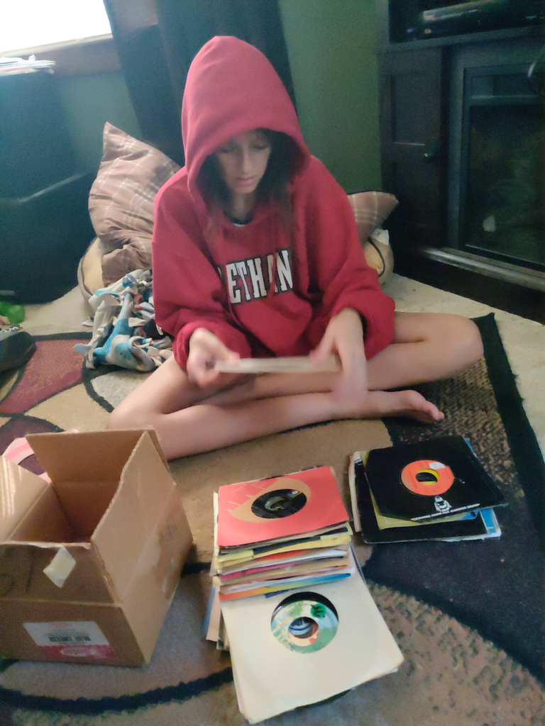 What are you up to this summer? Kenna playing old 45 records 