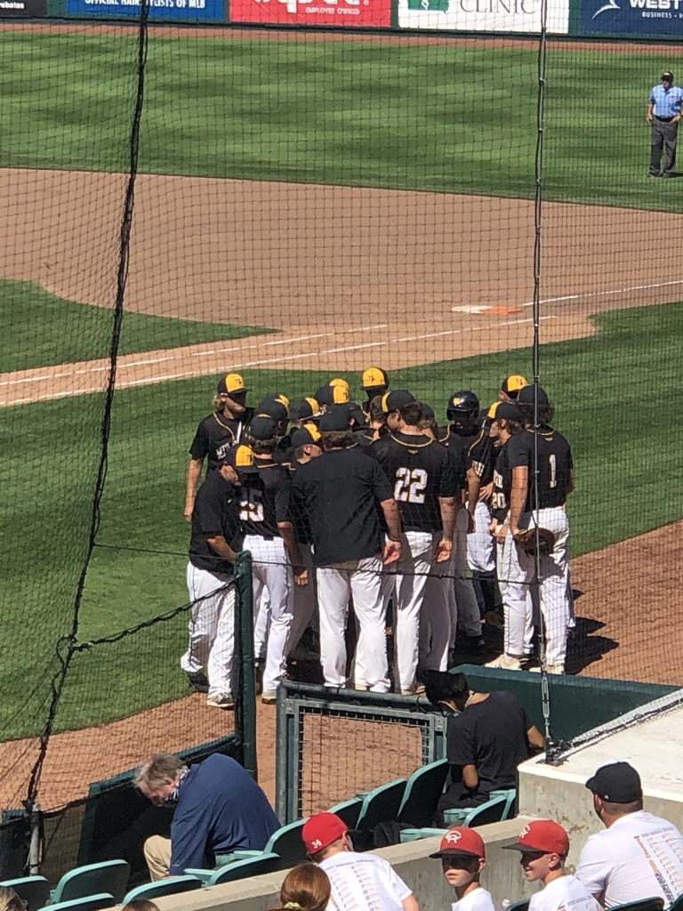 Huddling up between innings.