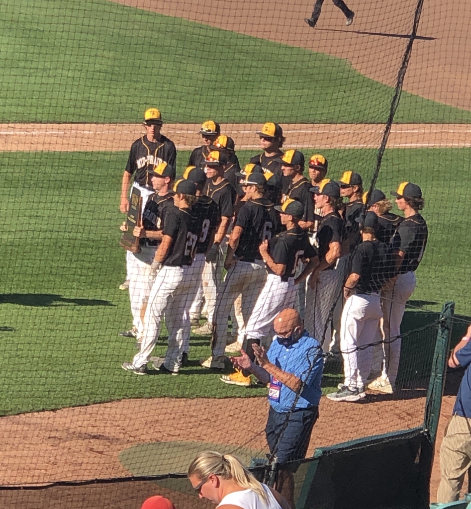 The team receives their state trophy