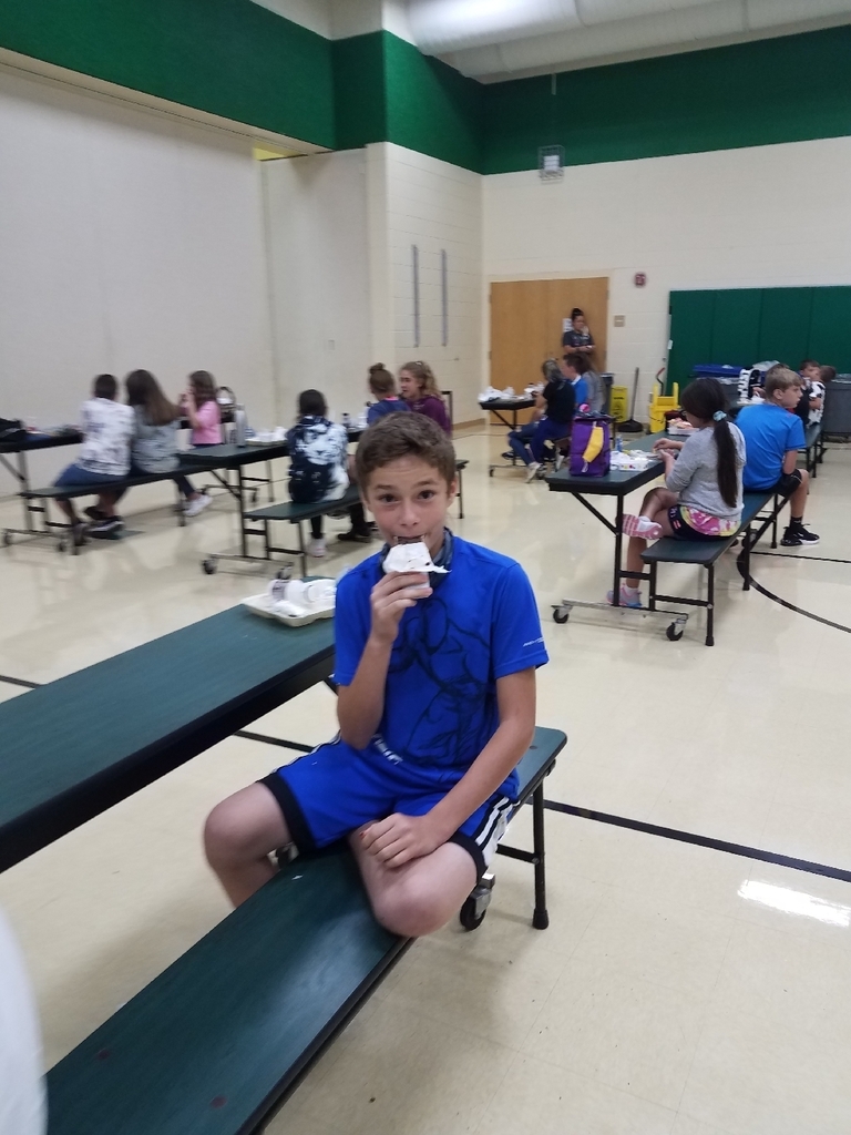 Student eating ice cream.