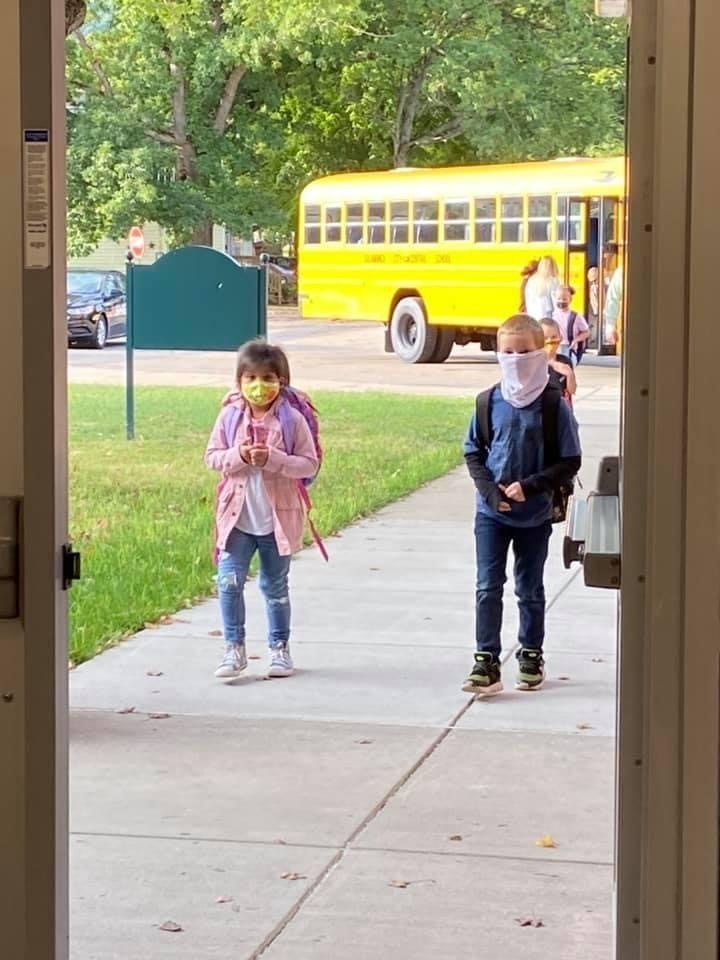 students walking into school