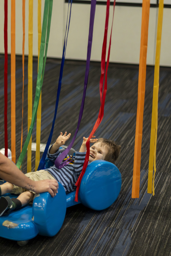 Smiling boy in a scooter