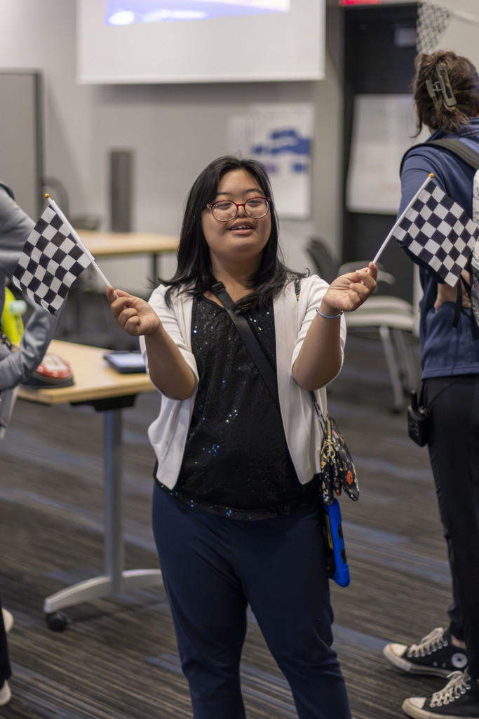 Smiling girl holding flags