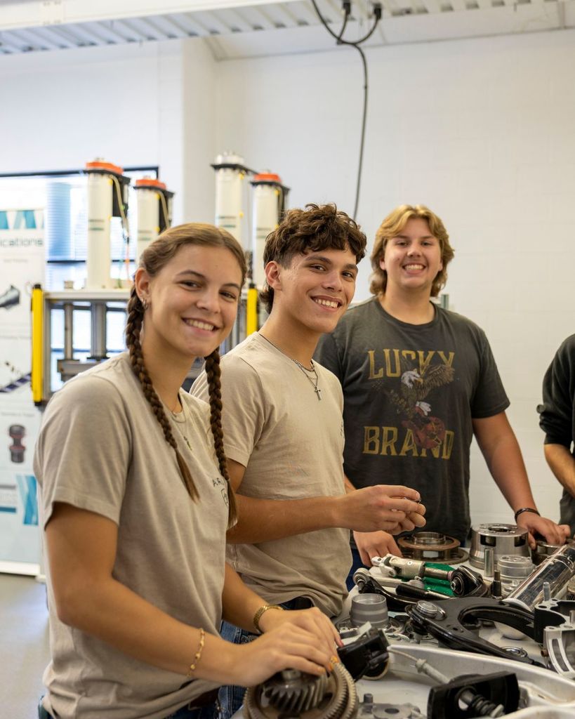 Kids smiling at the camera.
